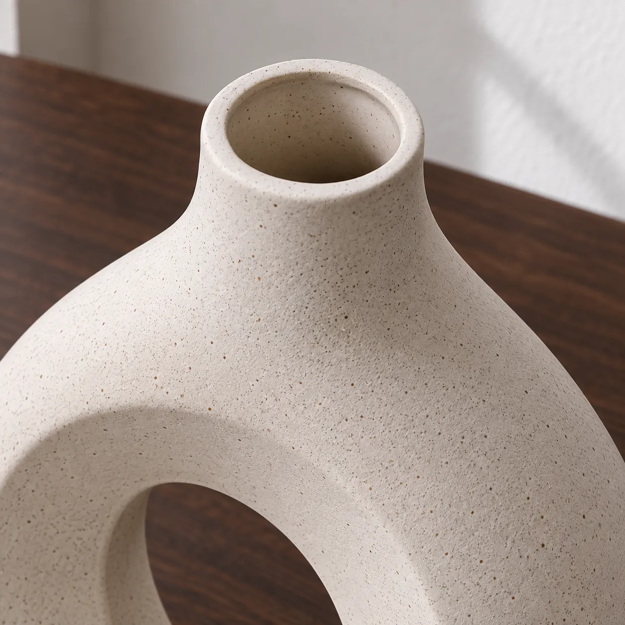 Close view of the larger vase mouth, rim and fine speckled finish